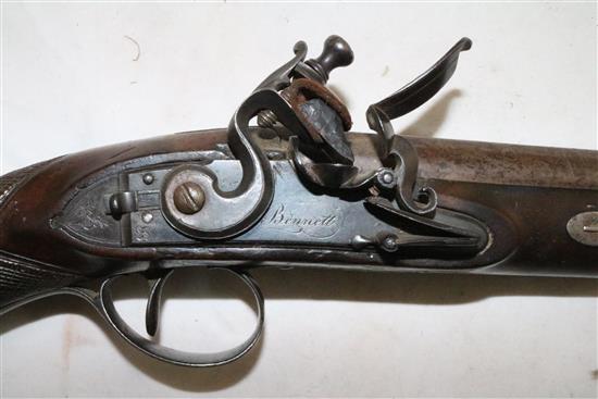 A George III flintlock holster pistol, by Bennett, c.1785, 14.5in.